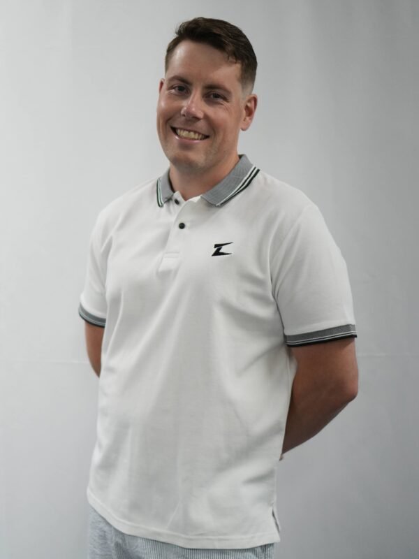 Side profile of the Z-Dual Stripe Men's Polo Shirt illustrating its tailored fit and modern design.