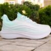 "Side profile showcasing the sleek design and breathable knit mesh of Aqua Stride Women Sneakers"