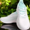 "Front view of Aqua Stride Women Sneakers in pastel aqua color"