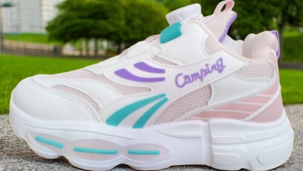 "Side profile of Z- Pixie Sprint Kids Sneakers displaying breathable mesh panels and durable synthetic leather overlays."